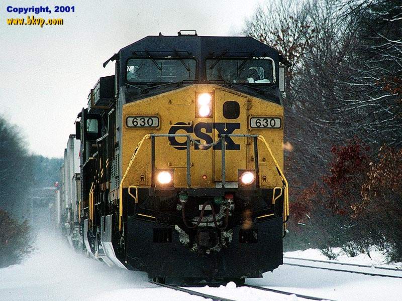Photo of A late running Q114 train kicks up fresh snow through Southboro, MA