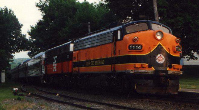 Photo of Cape Cod Railraod 1114 leads a train into Sandwich, MA.