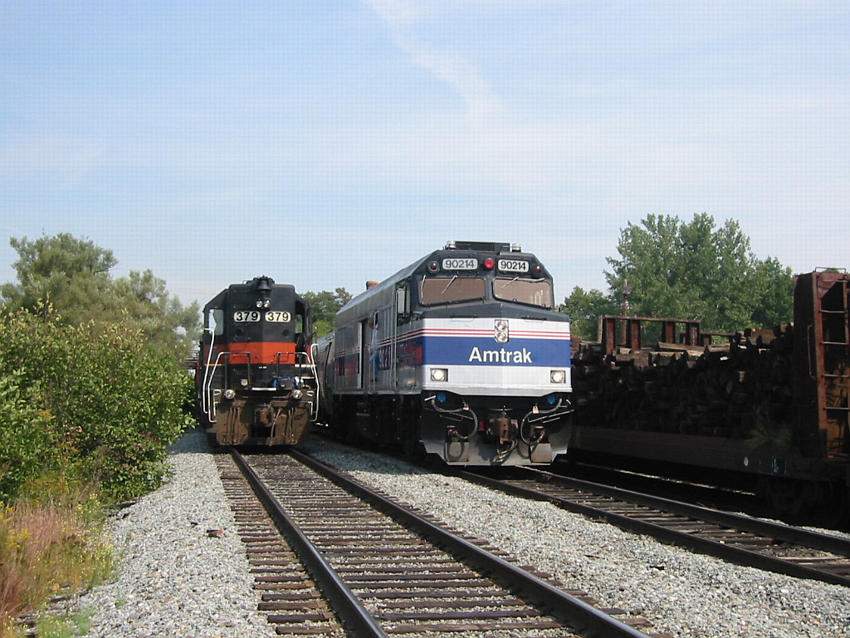 Photo of MEC 379 gets passed by Amtrak 90214 at Dover, NH