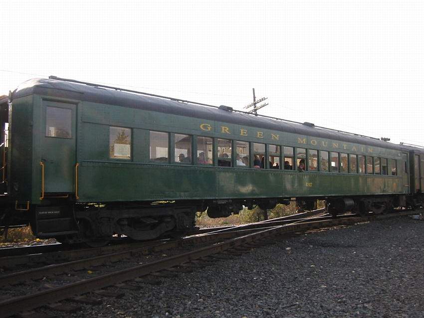 Photo of Green Mountain 1317 in its new paint crosses the diamond at Palmer, MA.