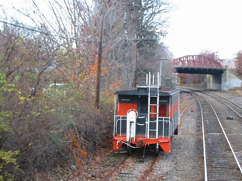 Photo of Freshly painted caboose sits on the South Track in Ayer