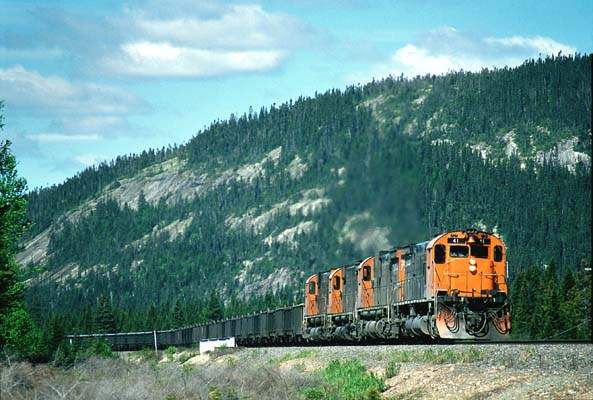 Photo of Four Alco-designed M-636's with a southbound ore train