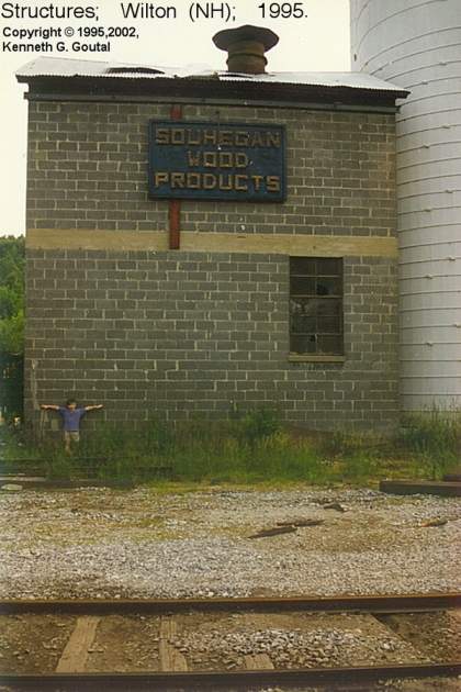 Photo of Souhegan Wood Products structures trackside in Wilton (NH), Summer, 1995.