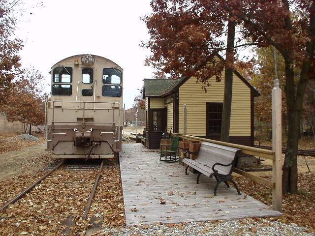 Photo of SW8 sits next to restored Chaplin Station - Conn. Eastern RR Museum