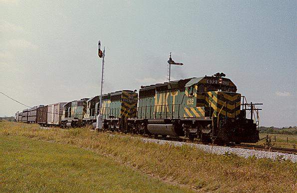 Photo of SD40-2's #632,634 & GP40 #213 split the semaphores near Wagoner, OK.