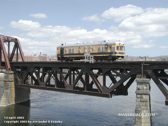 Photo of Sperry Rail Service car #146 over the Merrimack River.