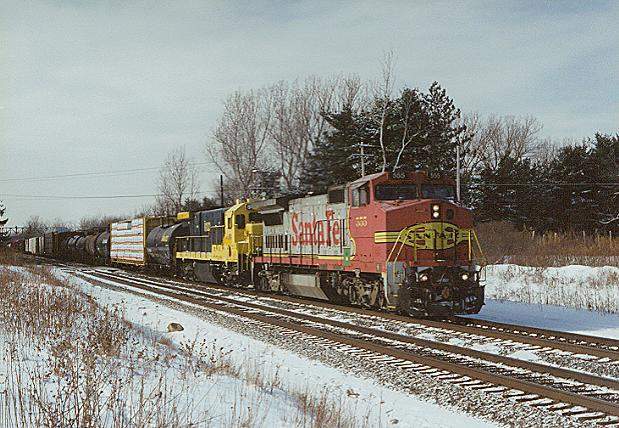 Photo of B40-8W #555 & Livingston Lease Unit eastbound on CSX at Corfu, NY.
