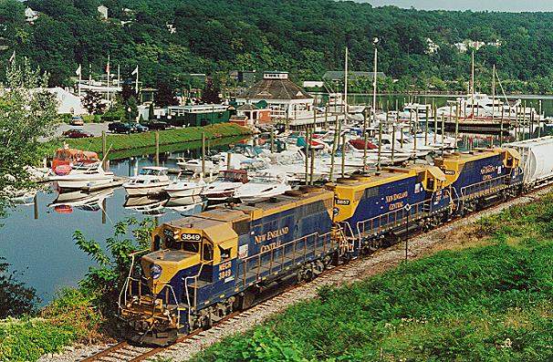 Photo of T#608 passes the marina at Norwich, CT with GP38's #3849,3857,3851.