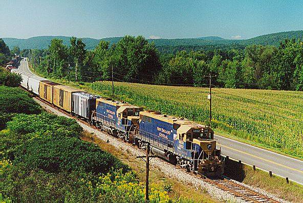 Photo of T#323 with GP38's #3852 & 3854 near S.Charleston, NH on a beautiful summer day.