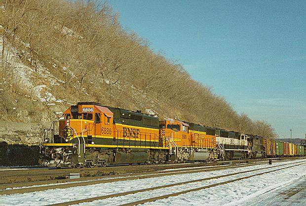 Photo of SD40-2 #6886 leads several BNSF schemes at St.Paul, MN.