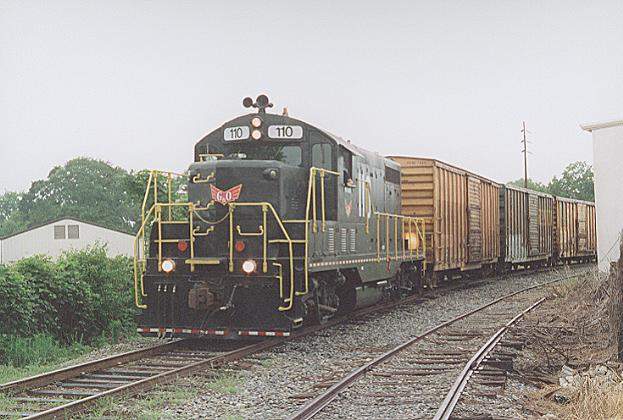 Photo of H&S Rail GP7u #110 is westbound out of Dothan, AL.