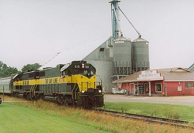 Photo of The Bay Line local passes the Headland, AL Peanut Co-Op.