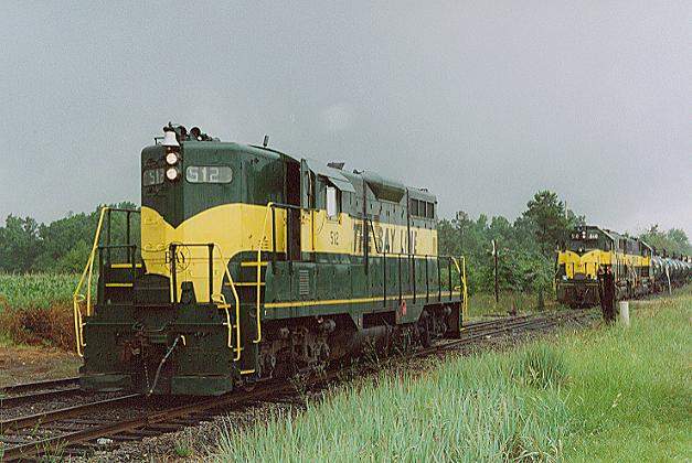 Photo of GP9 #512 waits for the local to bring it's train in the yard near Abbeville, AL.