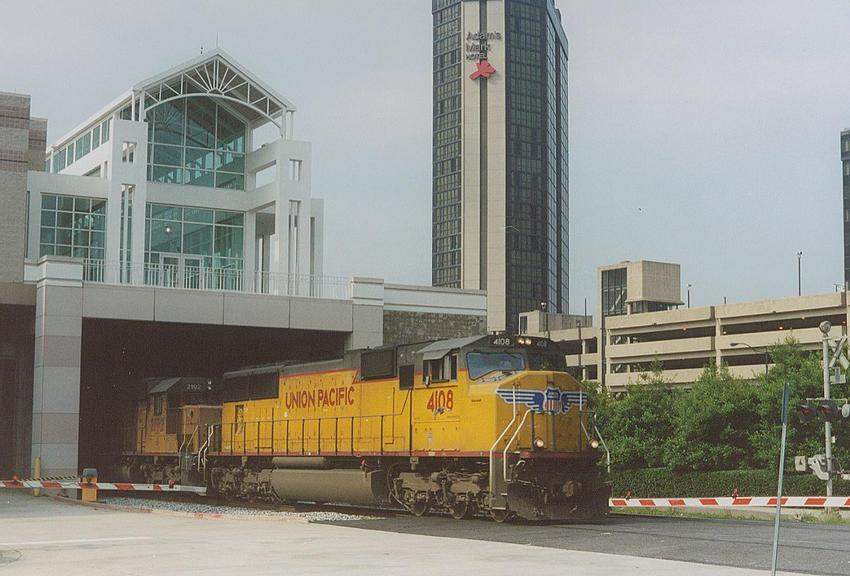 Photo of UP SD70M #4108 pops out of the Mobile, AL  Convention Center.