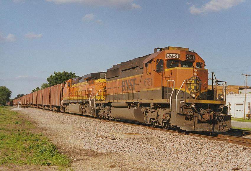 Photo of SD40-2 #6751 & C44-9W #4323 on unit grain train at Billings, MO.