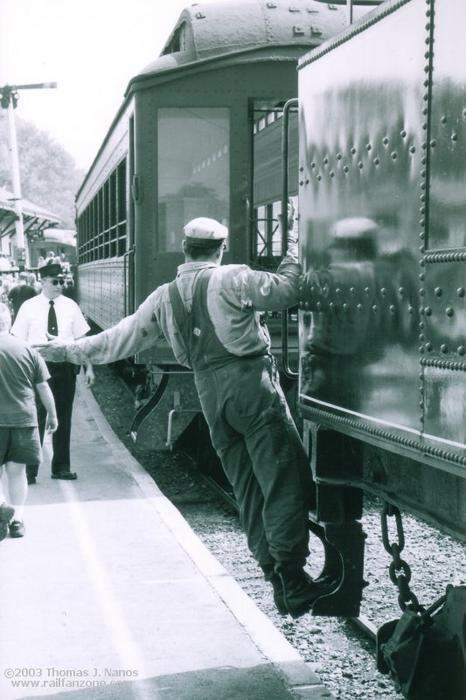 Photo of Fireman guiding the locomotive into a coupling