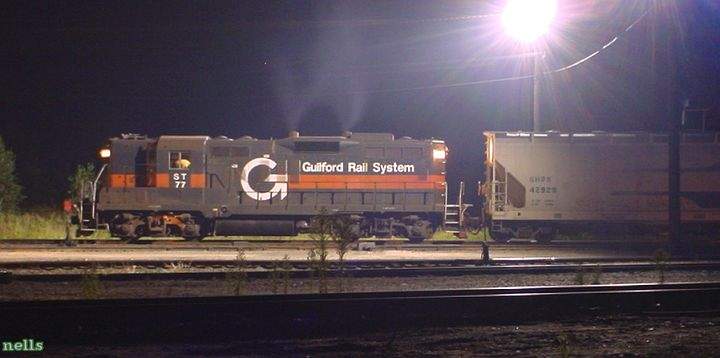 Photo of Guilford ST GP9 #77 in a dark E Deerfield