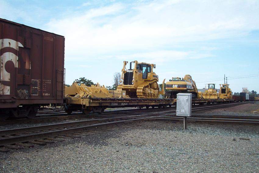 Photo of Caterpillar Tractors on Flat Cars