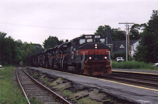 Photo of MEC 502 heads 'em west through Ayer, June, 2003.
