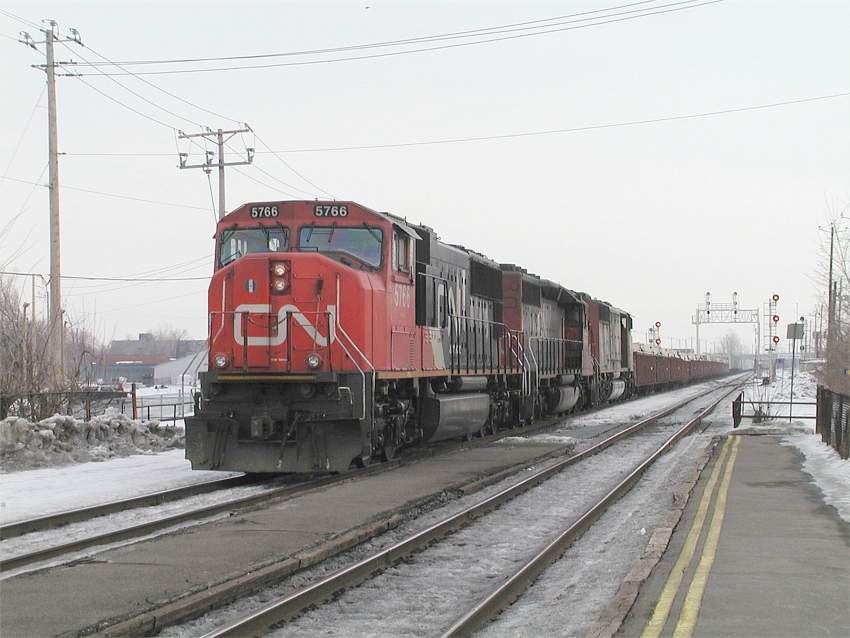 Photo of CN SD75i 5766 leads a westbound at St Lambert, Quebec