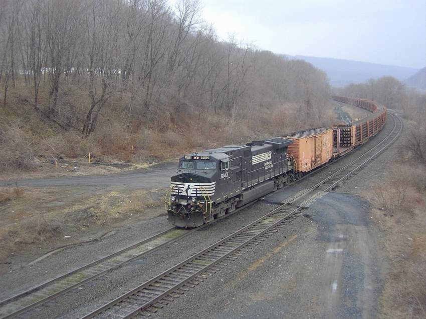 Photo of NS 9143 Hauls a load of welded rail into Enola after crossing Rockville Bridge