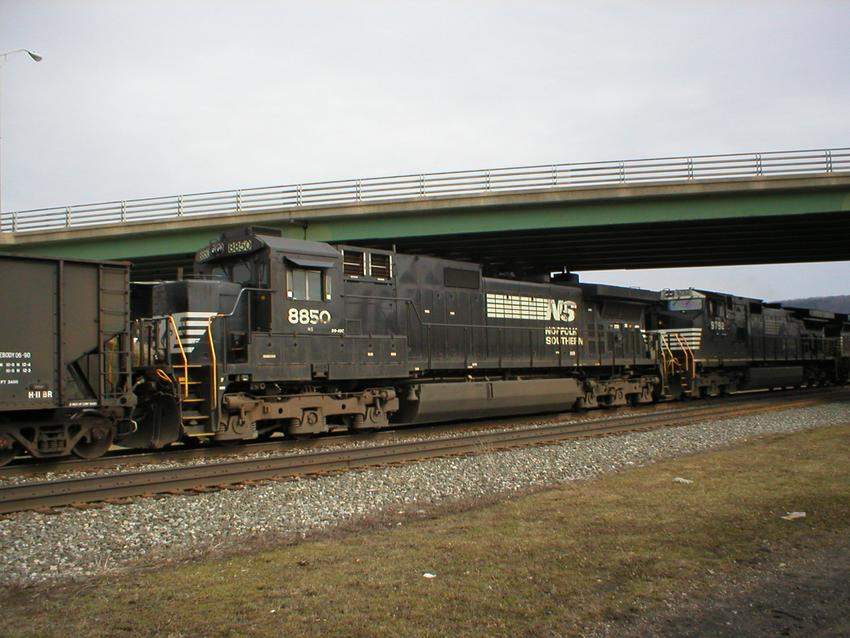 Photo of C40-9 8850 trailing two widecabs on a long unit coal train through Hornell.