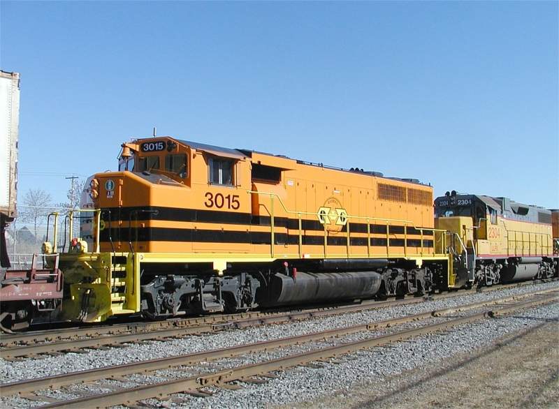 Photo of QG 3015 trails the consist at St Martin Jct, Quebec.
