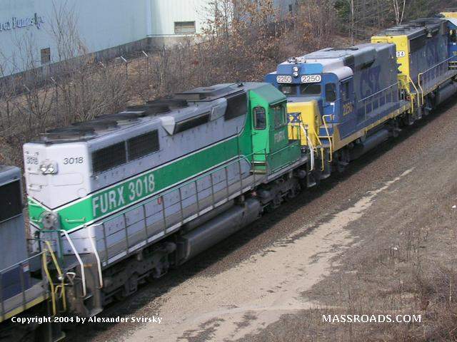 Photo of Westbound CSX train Q421 units include SD40 FURX #3018 and CSX road slug #2250