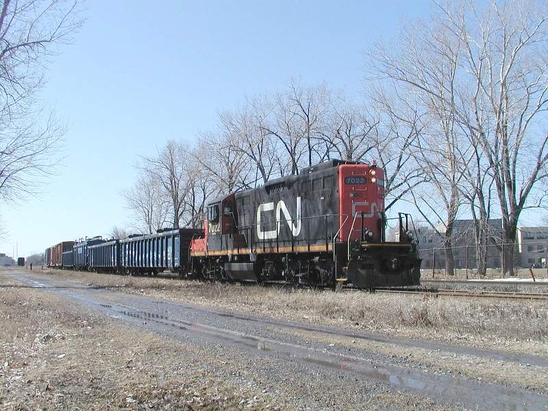Photo of CN GP9 7022 operated by the man on the ground. Eerie feeling!