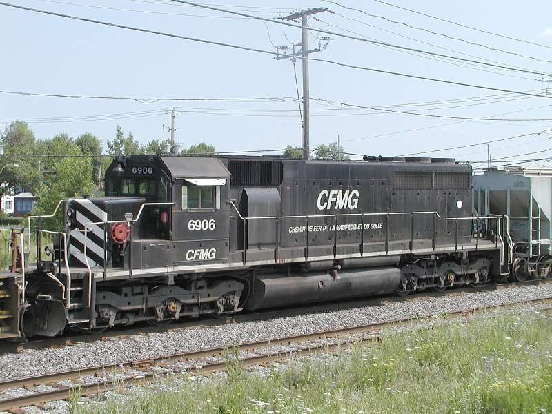 Photo of CFMG ex CN SD40 6906 westbound at Ville LeMoyne, Quebec 11-July-2004