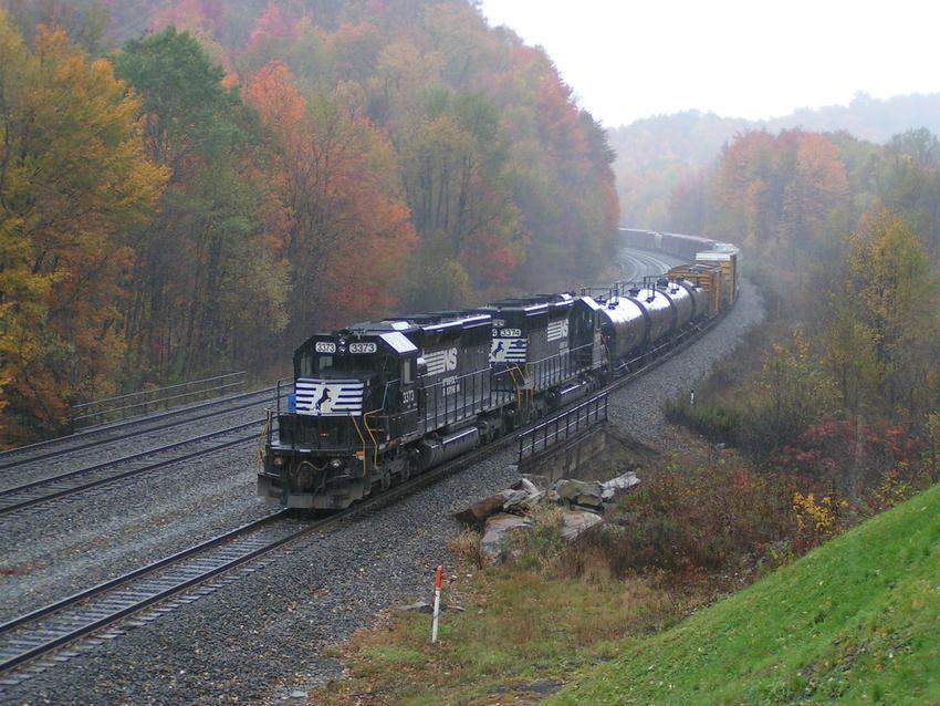 Photo of NS 3374 & 3373 pushing a freight up the grade in colorful October