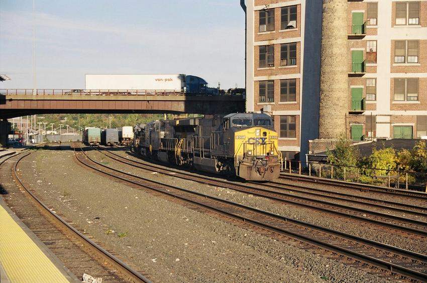 Photo of CSX 631 leads a consist under I-290 to make up its train