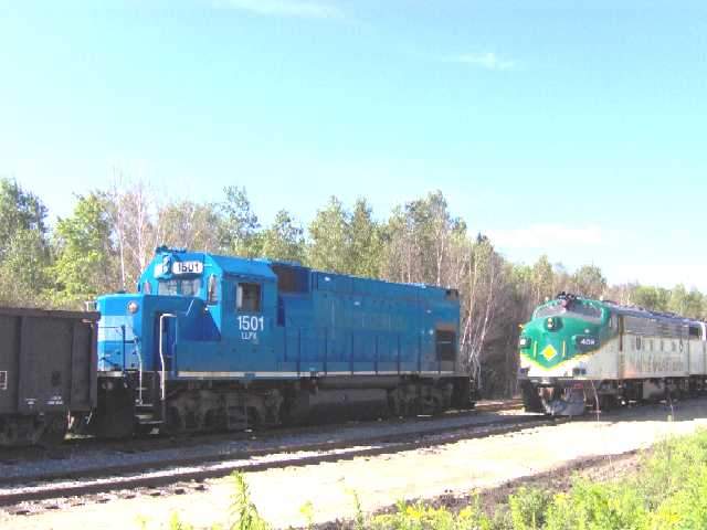 Photo of ME Freight and Passenger Trains meet in Brunswick.