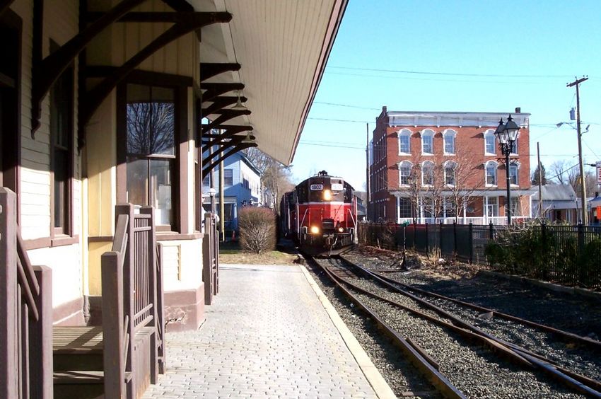 Photo of a GP9 comes up to restored New Milford station.
