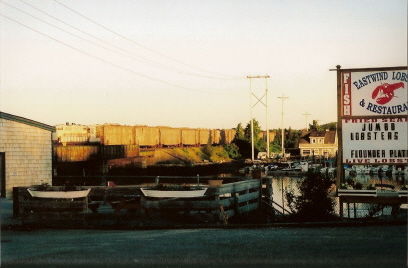 Photo of BCLR 1702 approaching canal bridge with empty trash train