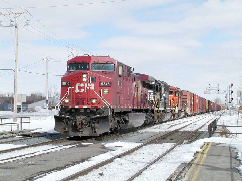 Photo of CP 9816  leads a detour train by St Lambert station on CN