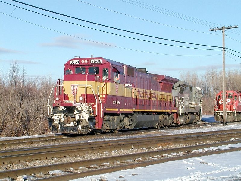 Photo of MMA B39-8E 8569 traverses the CN interchange track at Delson,Quebec
