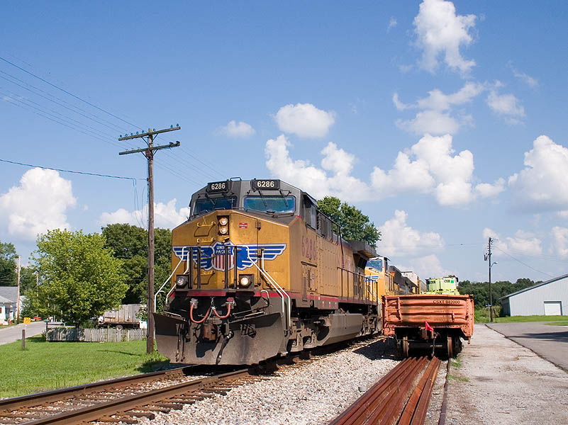Photo of CSX Q504 has UP power at the point at Campbellsburg, IN.