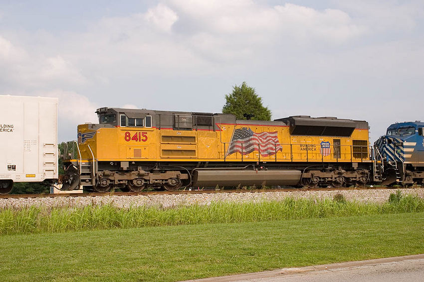 Photo of UP 8415 trails the consist on CSX train Q687 in New Albany, IN.