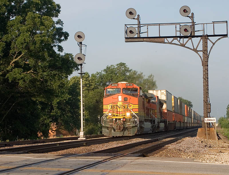Photo of BNSF 4413 leads an eastbound intermodal train through Lomax, IL.
