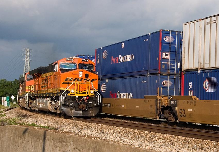 Photo of BNSF 7643 leads a westbound stack train into Fort Madison, Iowa.