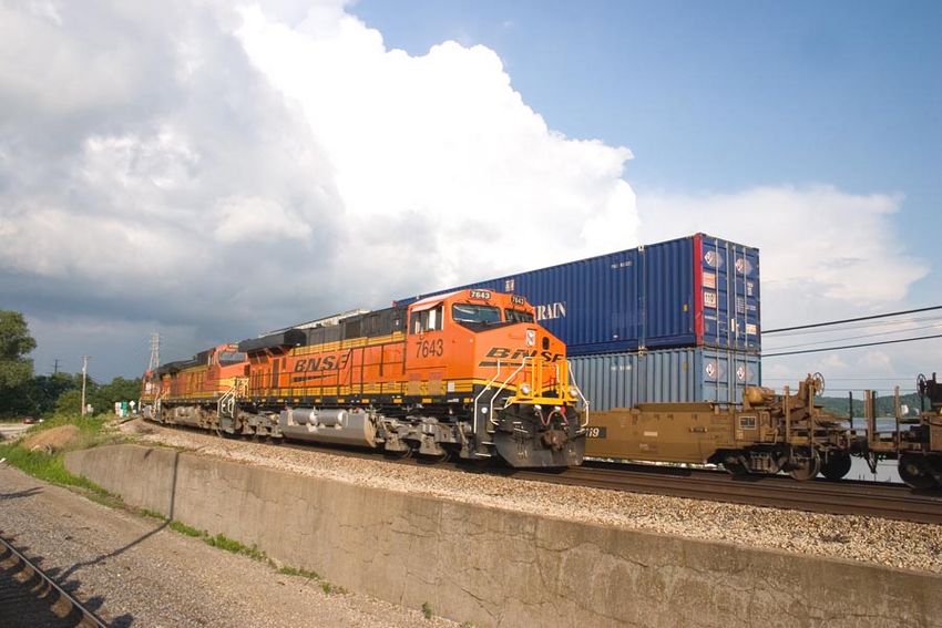 Photo of BNSF 7643 leads a westbound stack train into Fort Madison, Iowa.
