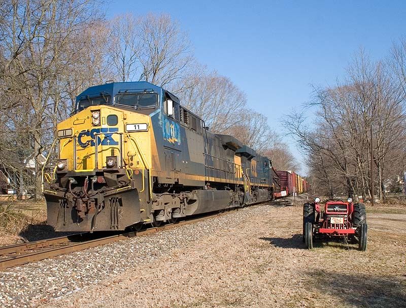 Photo of CSX 11 leads train Q573 through Henryville, IN.