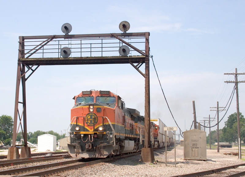 Photo of BNSF 1056 leads a stack train through Lebo, Missouri.