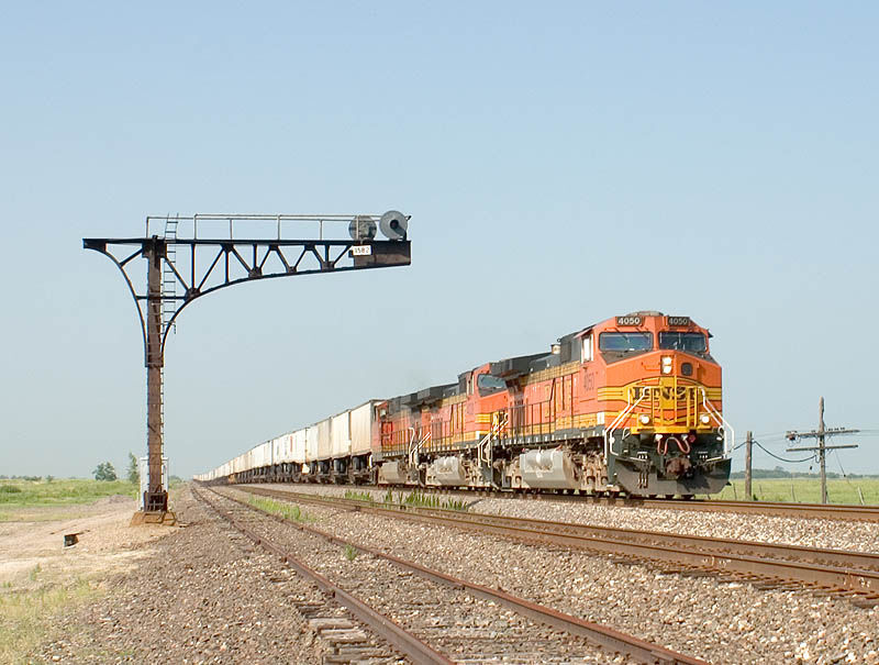 Photo of BNSF 4050 leads a stack train at Aickman, Kansas.