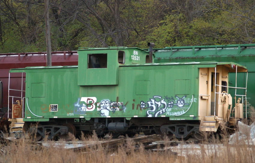 Photo of BN caboose - bruised & battered
