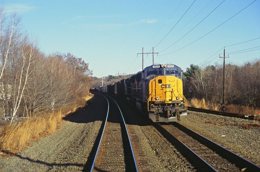 Photo of CSX W Bound as viewed from E Bound MBTA Local, East of Worcester MA