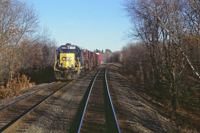 Photo of CSX W Bound Local as viewed from E Bound MBTA Train, near Ashland MA