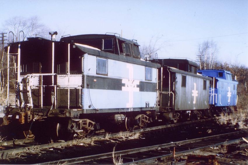 Photo of Three B&M cabooses in the Fitchburg Yard