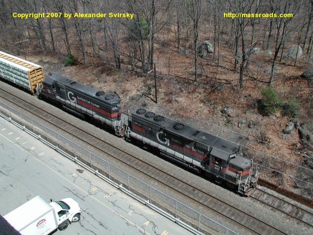 Photo of NMED waits on the runner at Shawsheen with GP40 #348 and SD39 #690.